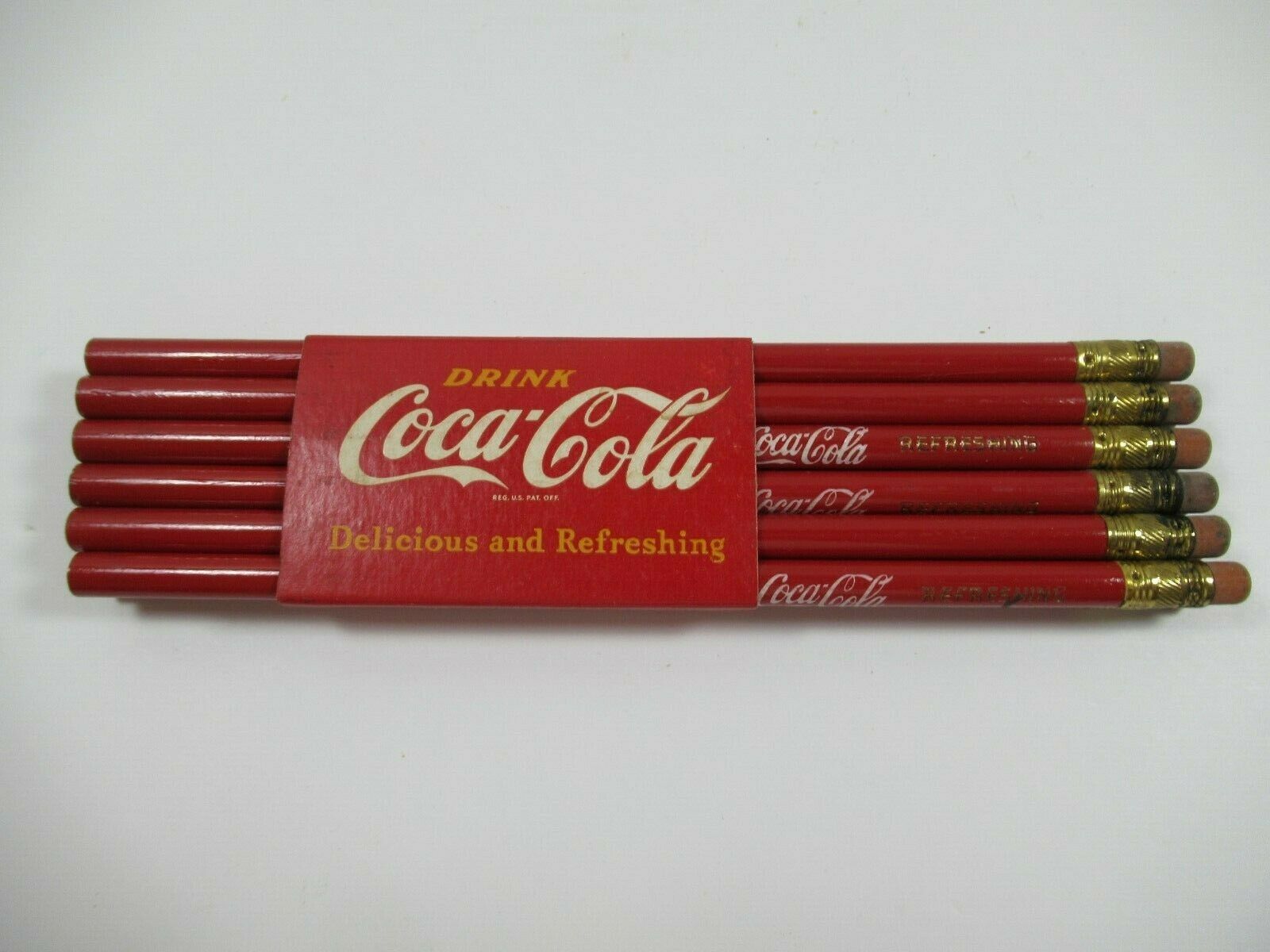 Vintage Coca Cola 12 Pencils With Band Holder "drink Coca Cola Delicious & Refre